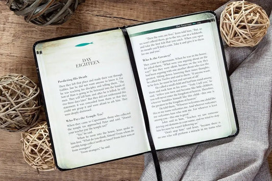 The Chosen Presents: A Blended Harmony of the Gospels - Devotionals open black-bound journal