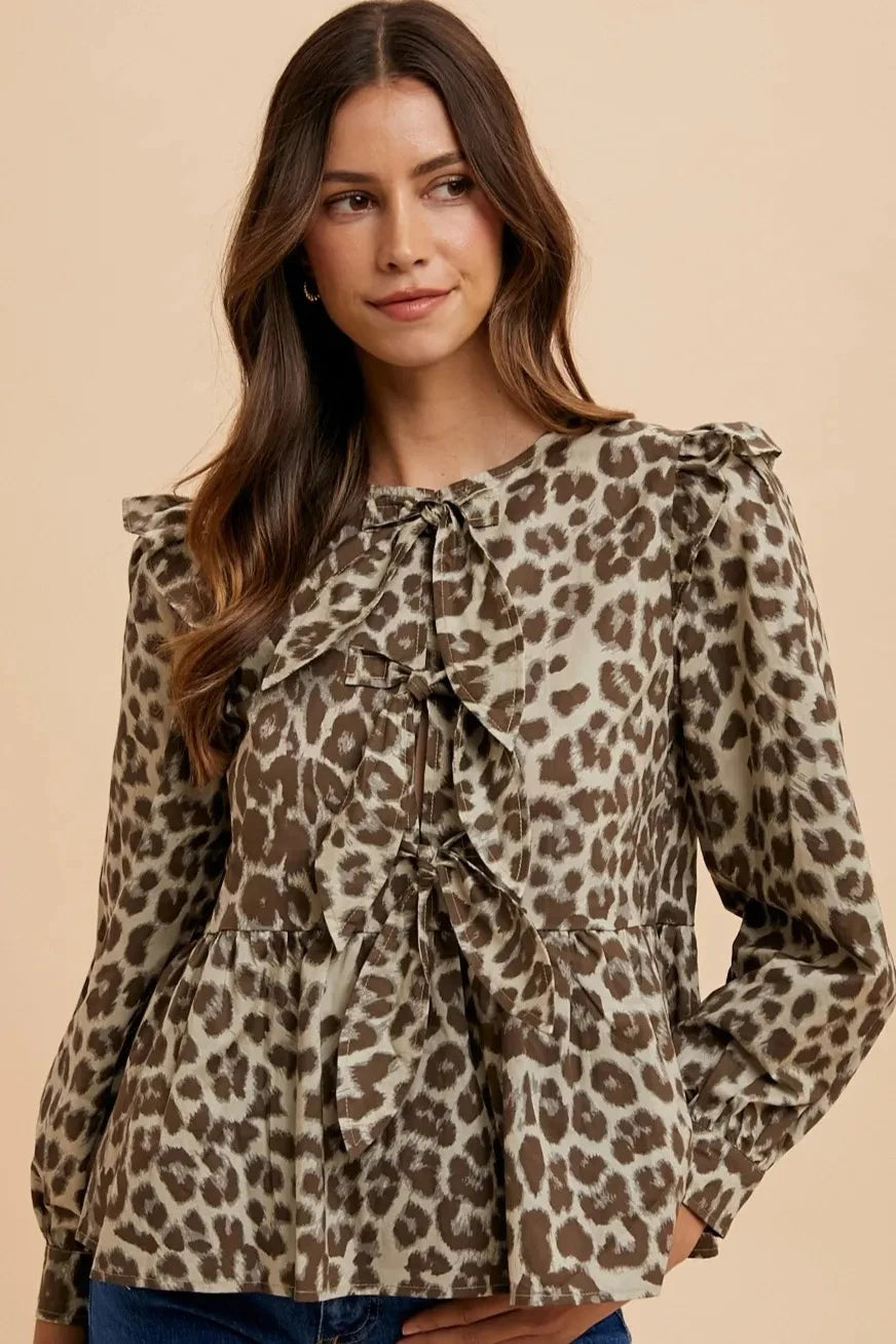 Woman in leopard print blouse